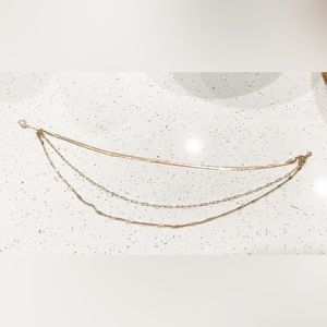 Gold colored three stacked necklaces